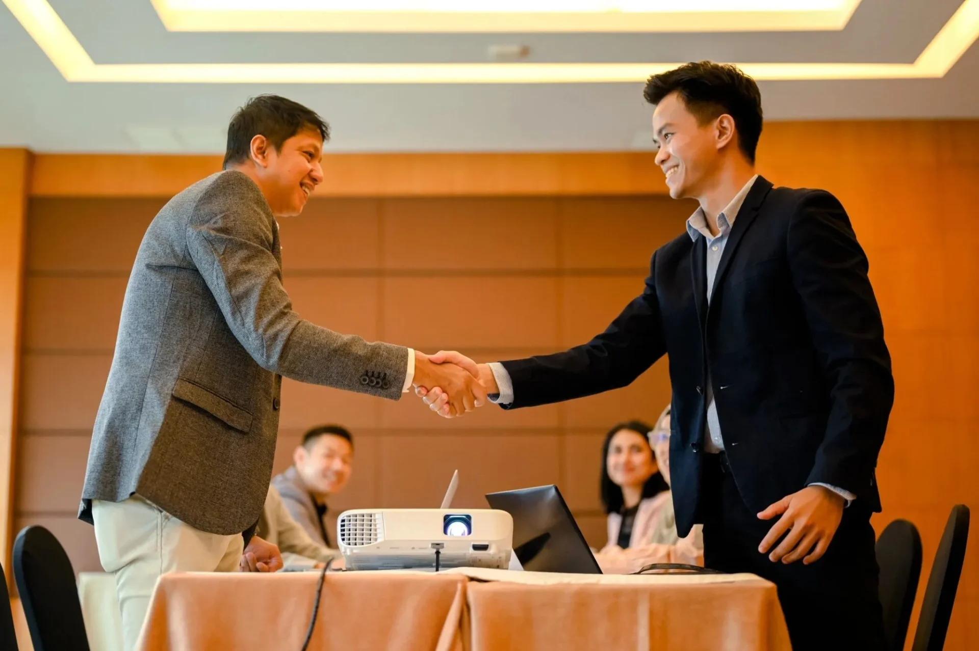Professional handshake in office setting