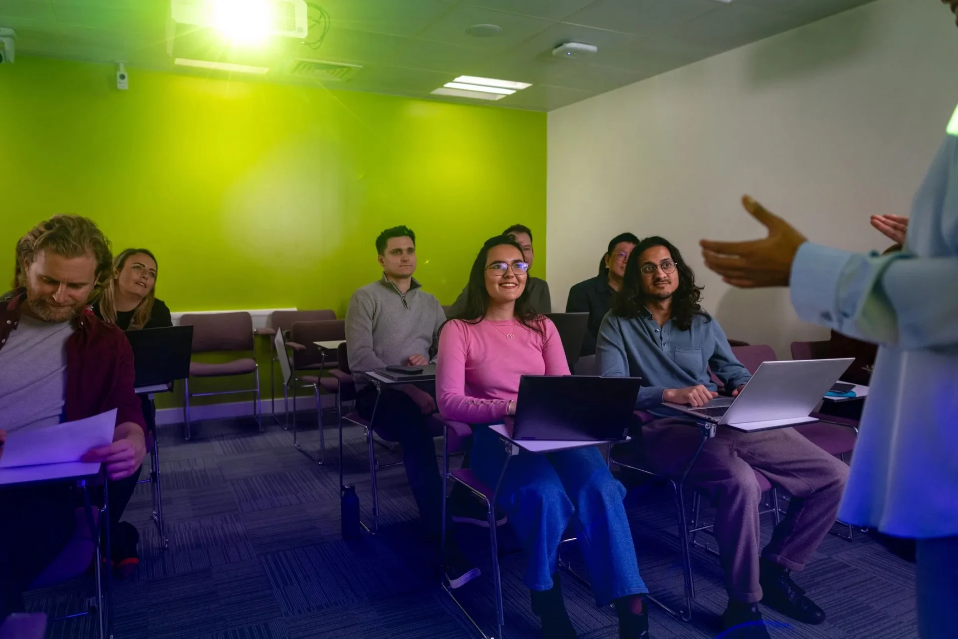 Students attentively listening in classroom lecture